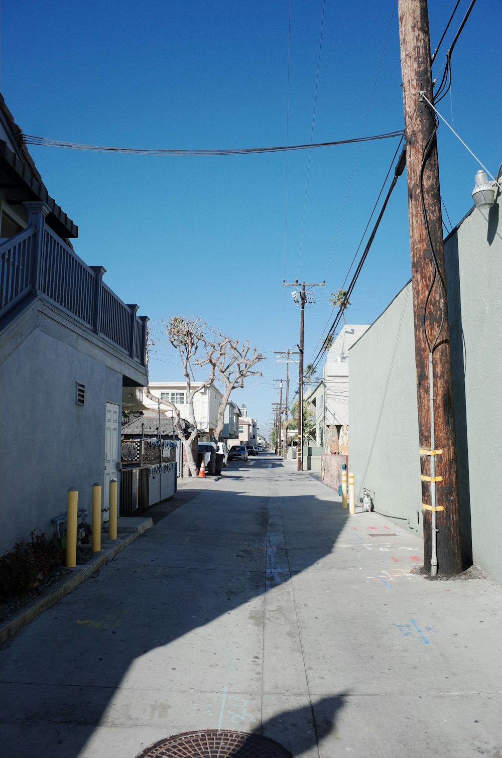 a street lined with buildings and a telephone pole