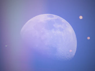 An ethereal video still showing swirling moonlight over textured paper art.