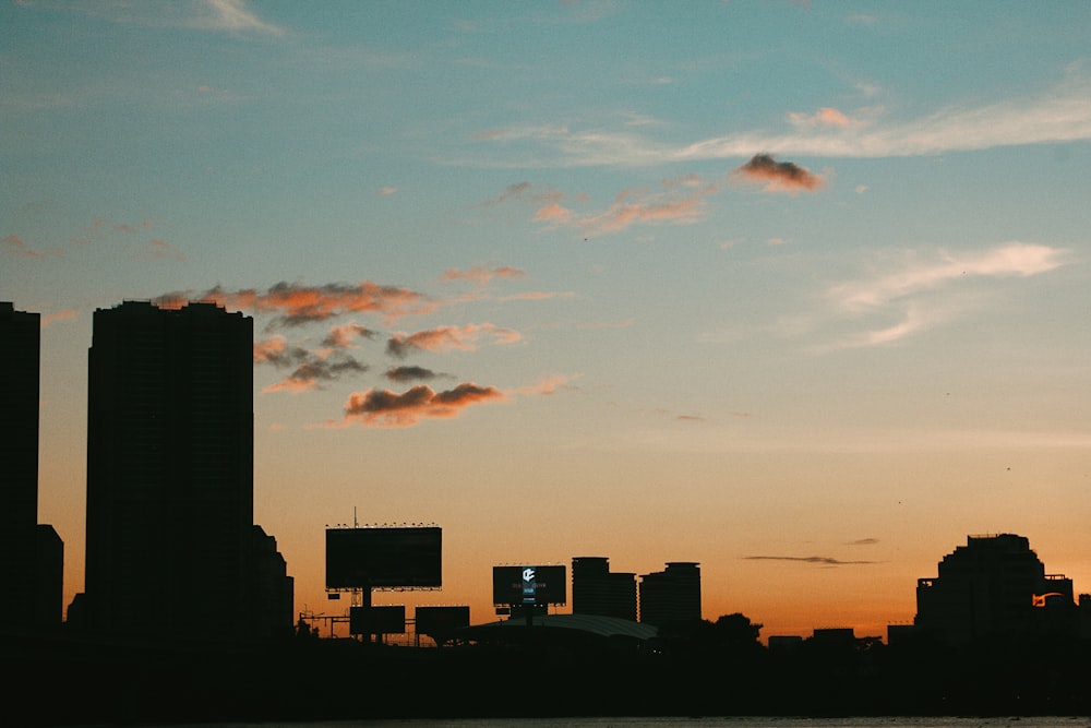 a view of a city skyline at sunset