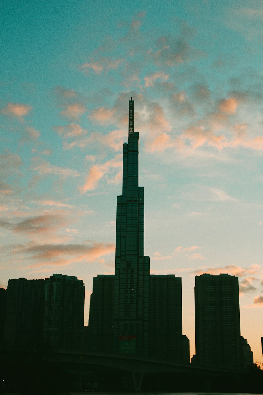 a very tall building towering over a city