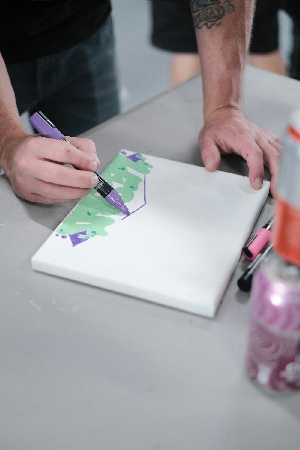 a man is cutting a piece of paper with scissors