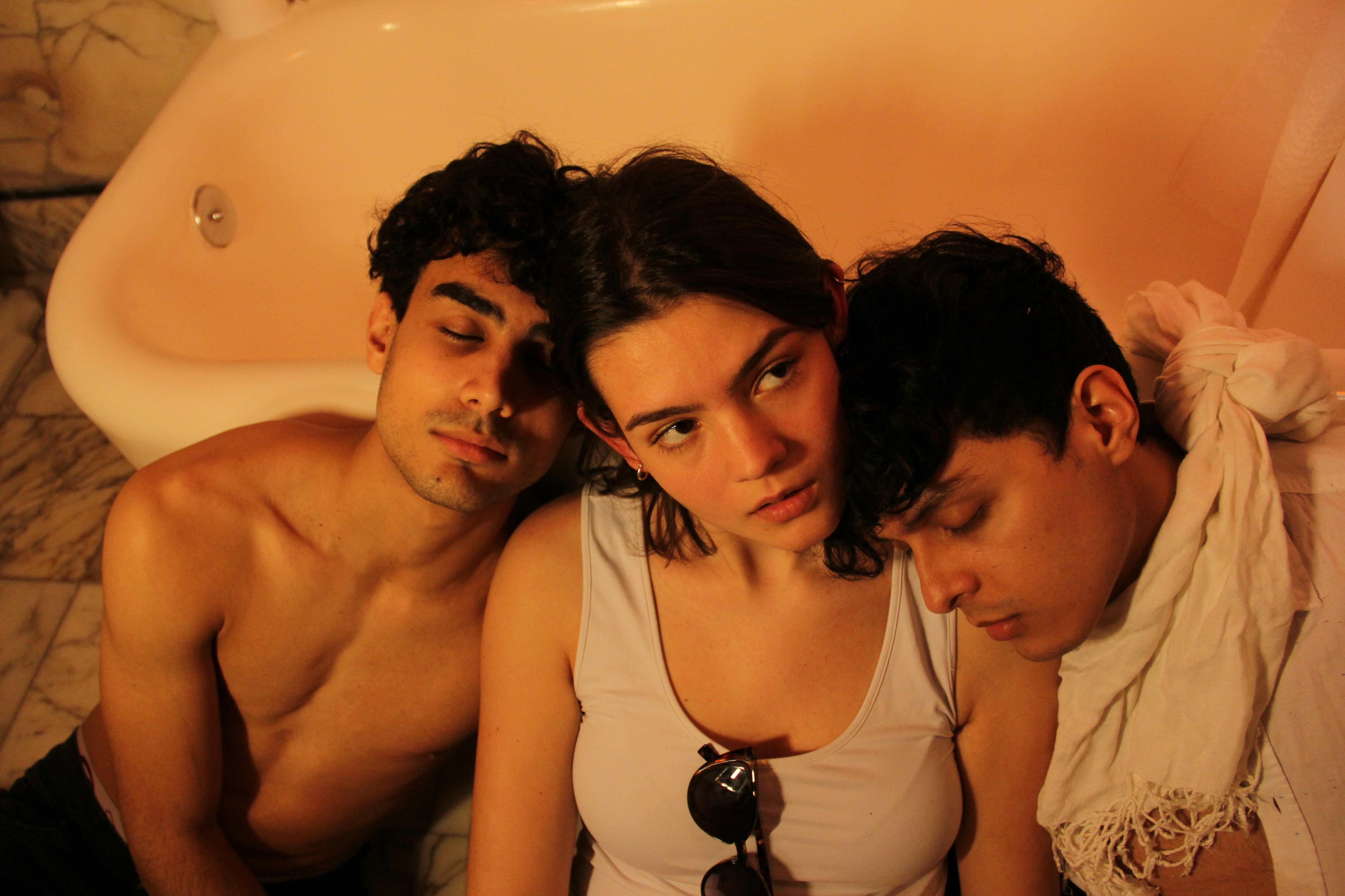 a couple of people that are laying in a bath tub