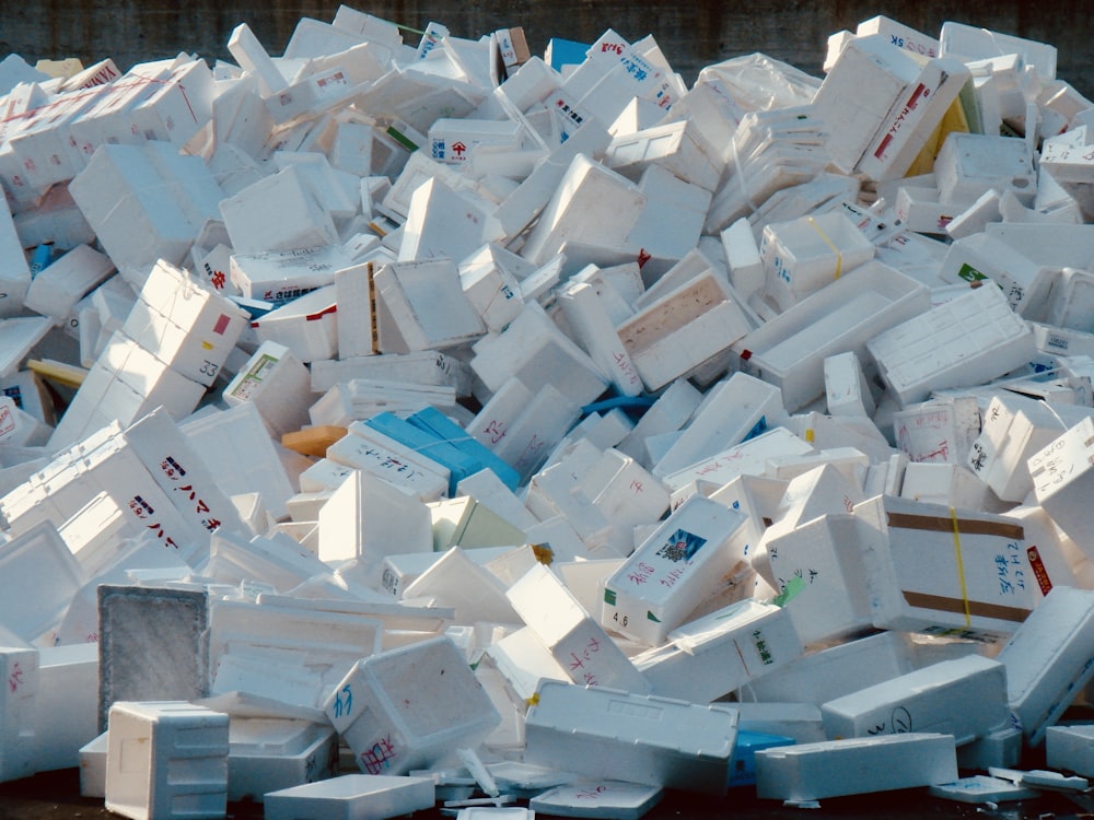 a pile of white boxes stacked on top of each other