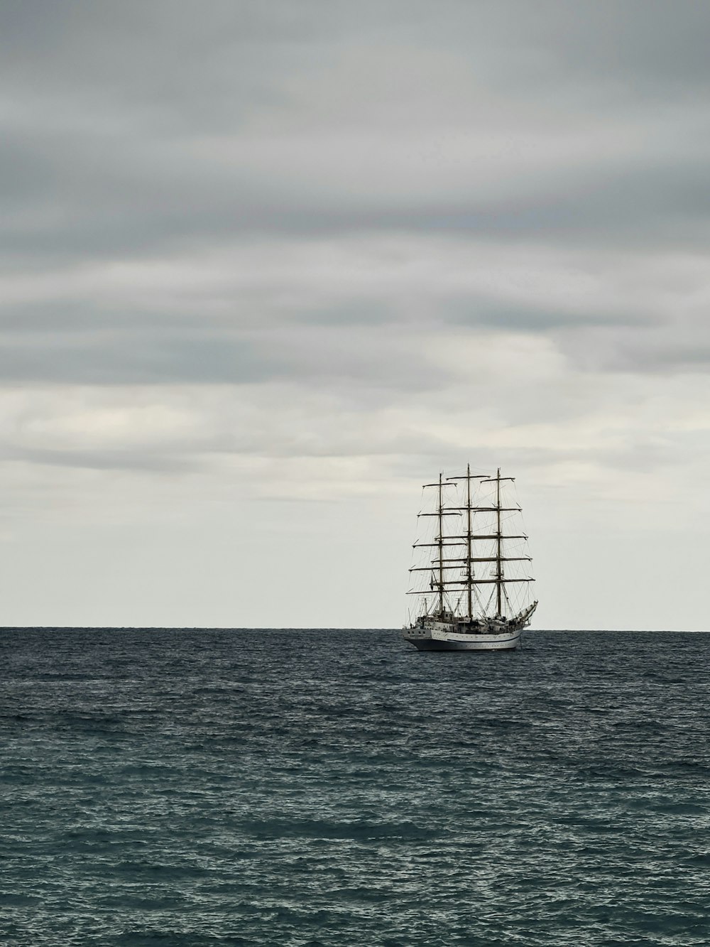 a large boat floating on top of a large body of water