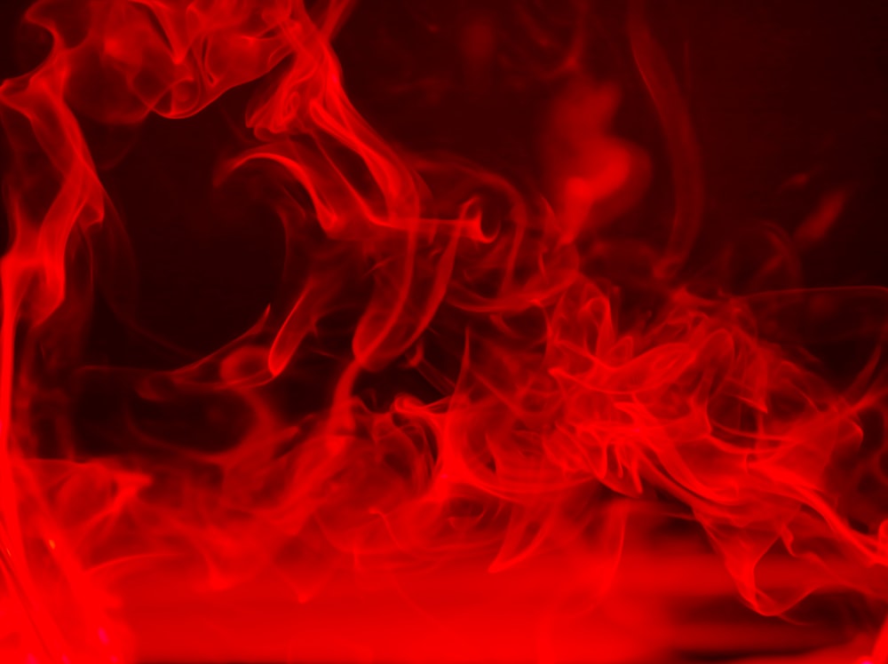 red smoke is shown in the dark