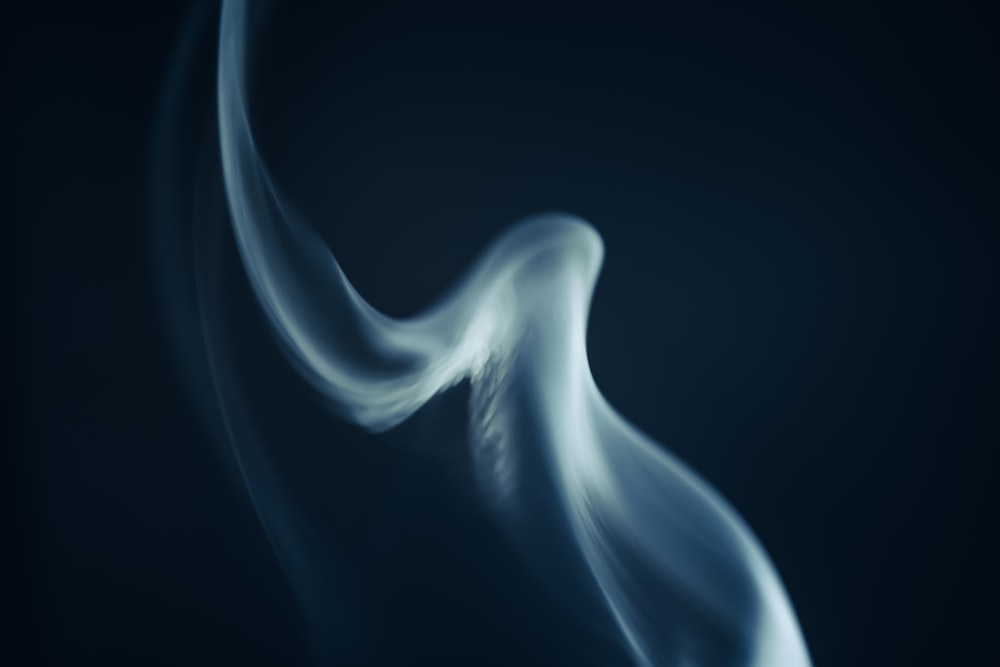a blurry photo of a blue and white smoke