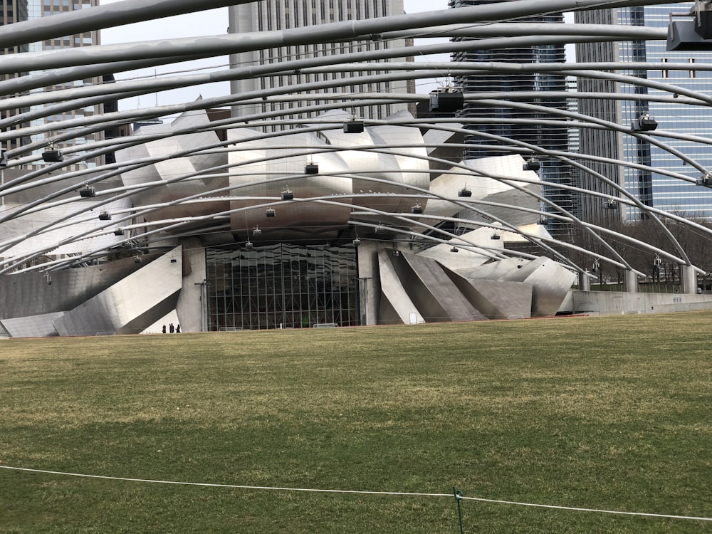 a view of a building with a large sculpture in the middle of it