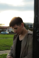 a man sitting on a bench using a cell phone