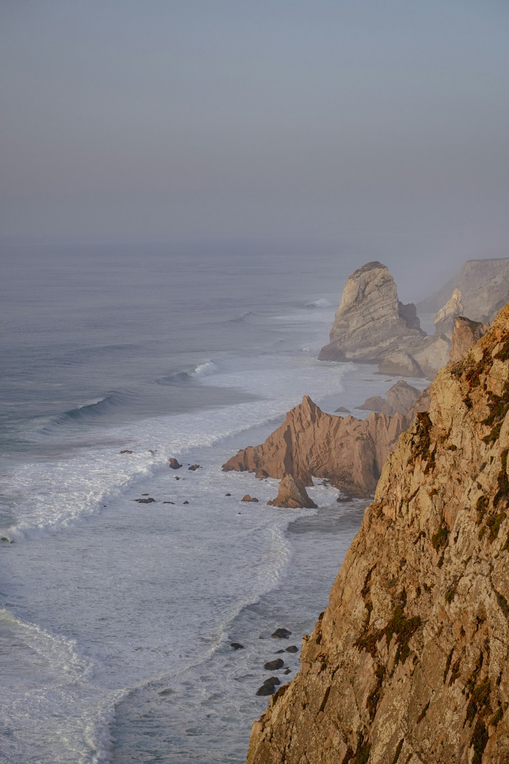 a view of the ocean from the top of a mountain