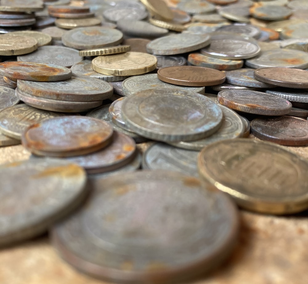 a pile of coins sitting on top of a table