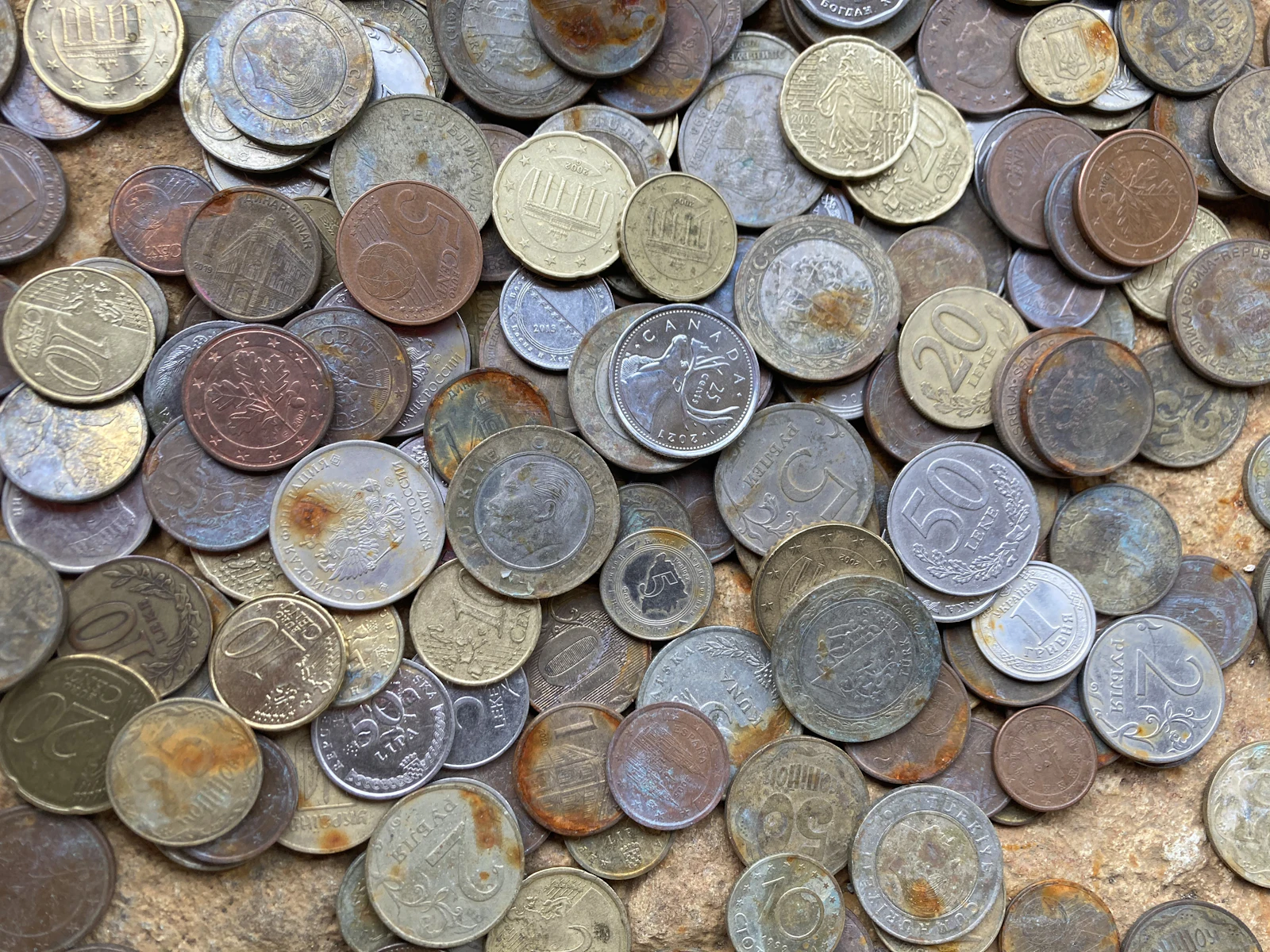 A pile of different types of coins