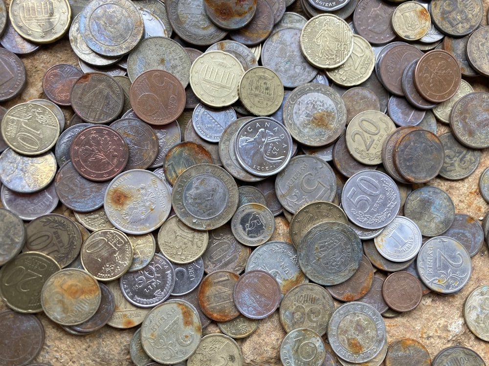 a pile of different types of coins