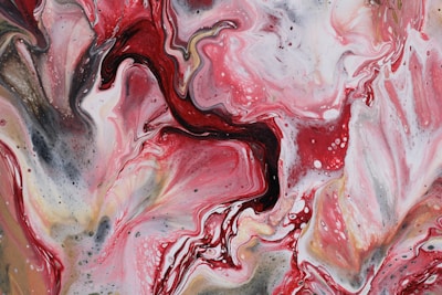 a painting with red and black swirls on it