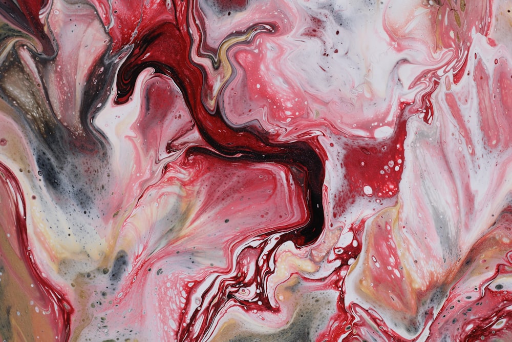 a painting with red and black swirls on it