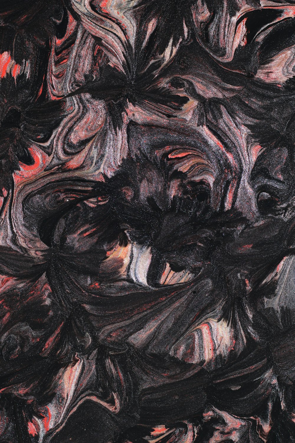 an abstract painting of black and red colors
