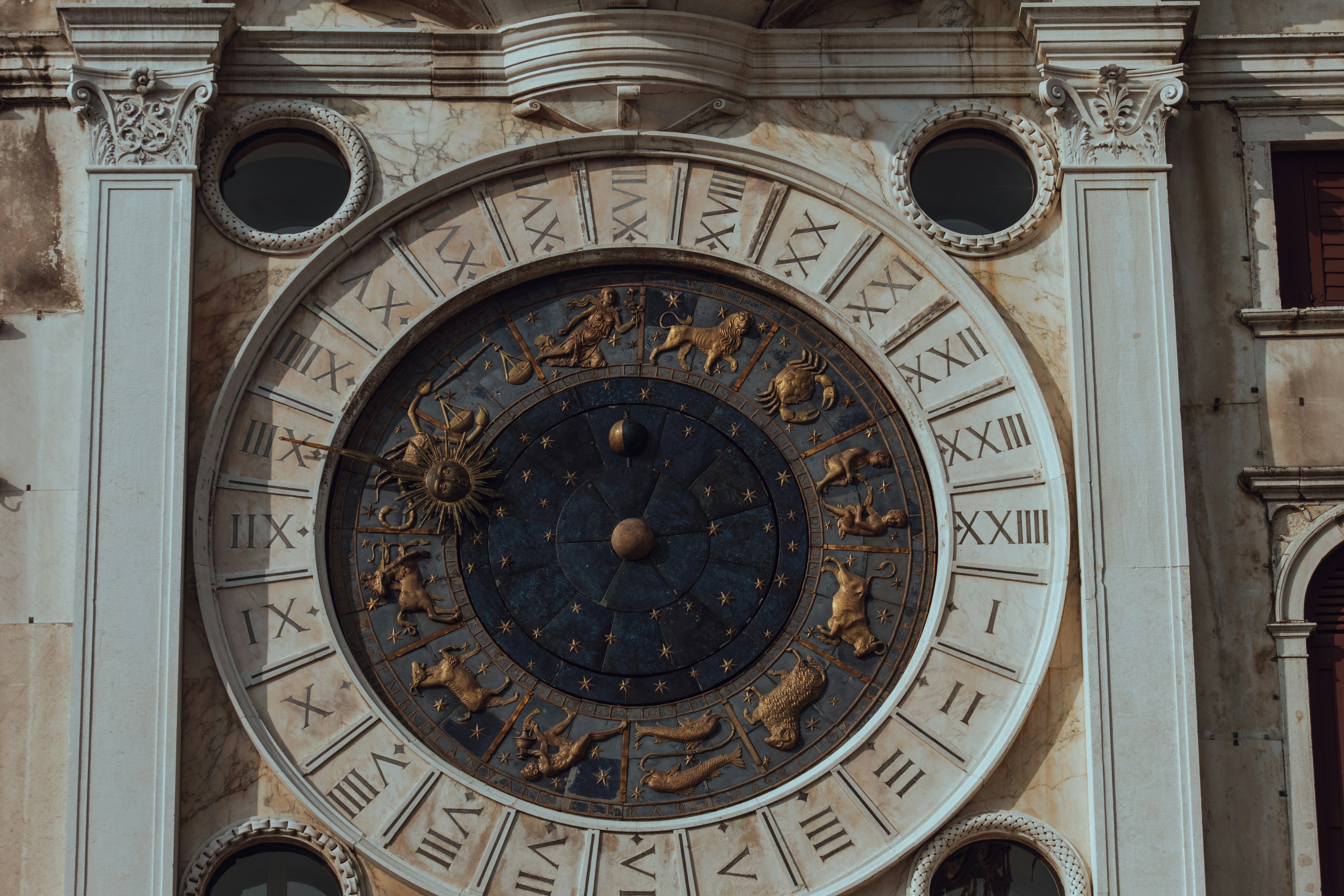 a large clock mounted to the side of a building