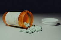 a bottle of pills sitting on top of a table