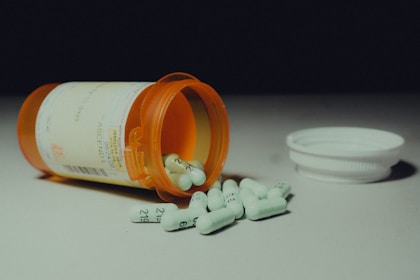 a bottle of pills sitting on top of a table