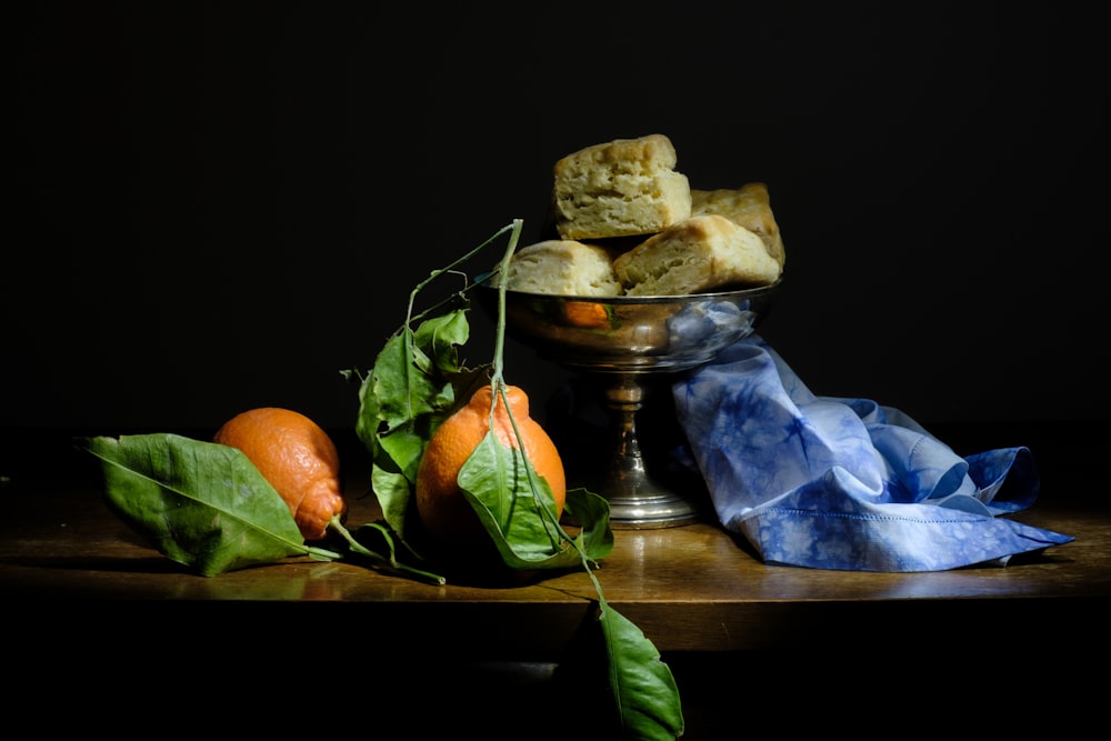 a bowl of food sitting on top of a wooden table