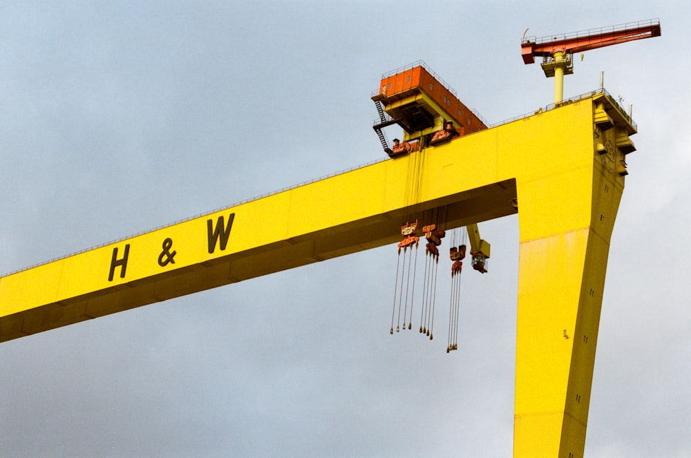 a large yellow crane with a crane on top of it