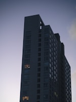 a very tall building with a sky in the background