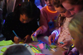 a group of children are playing with sticky notes
