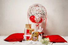 a bunch of presents are on a bed