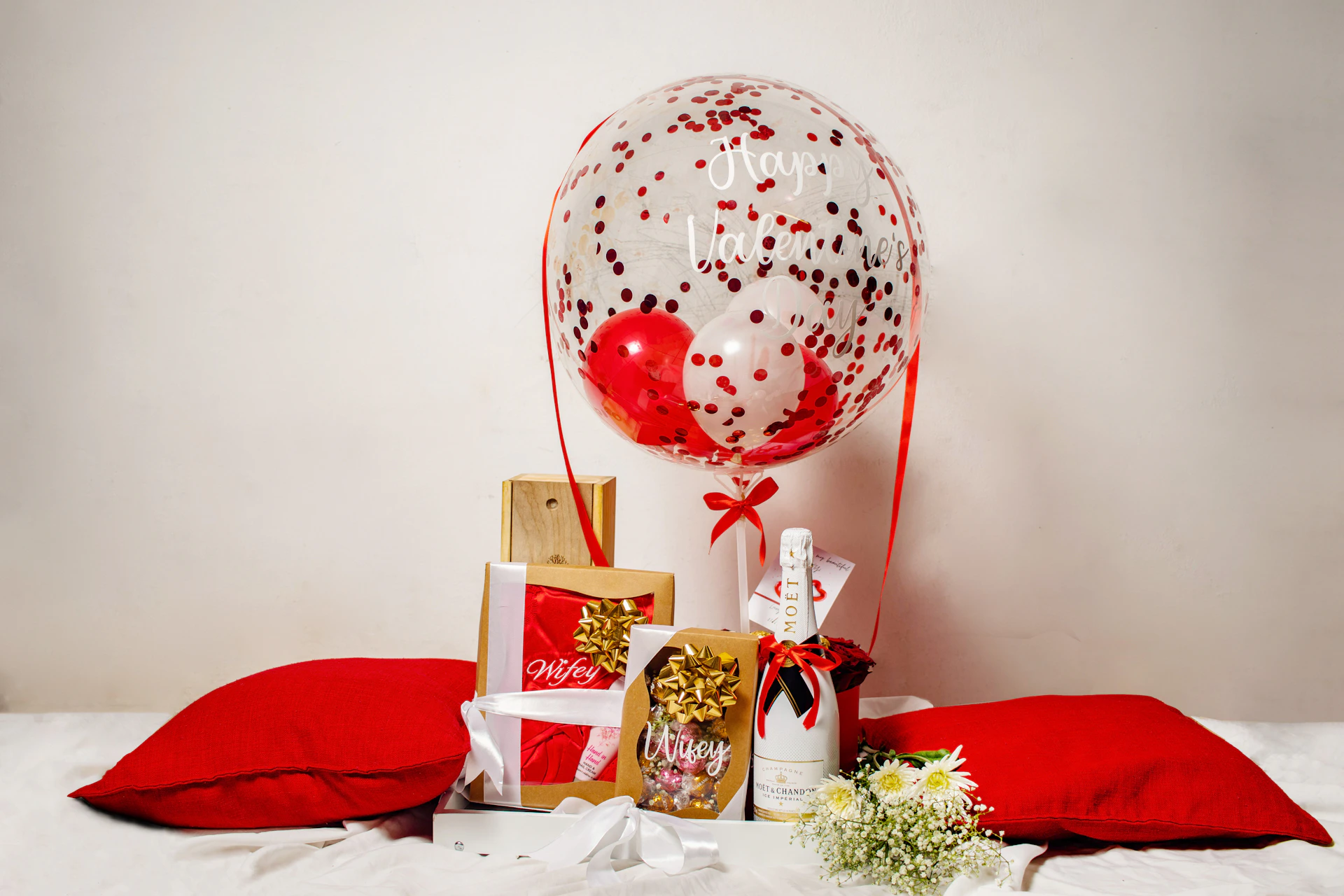 a bunch of presents are on a bed