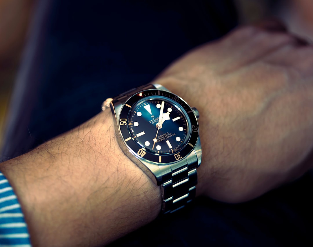 a man wearing a watch on his wrist,