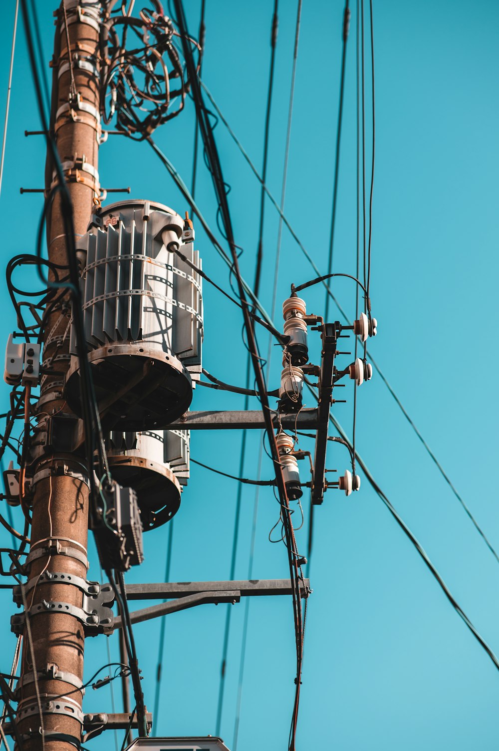 a power pole with wires and wires attached to it