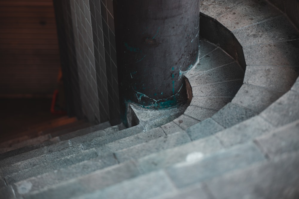 a close up of a metal object near a building