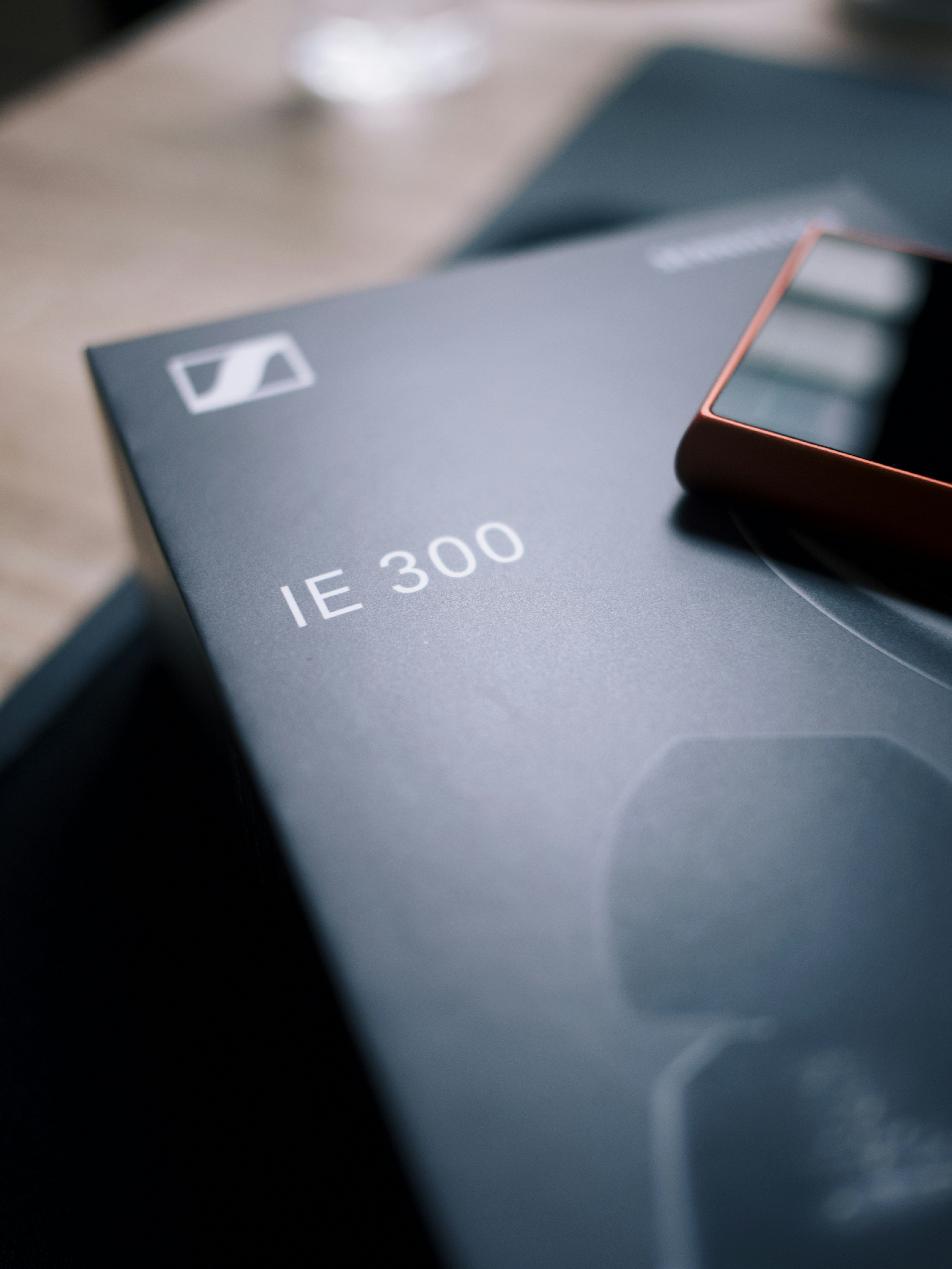 a cell phone sitting on top of a black box