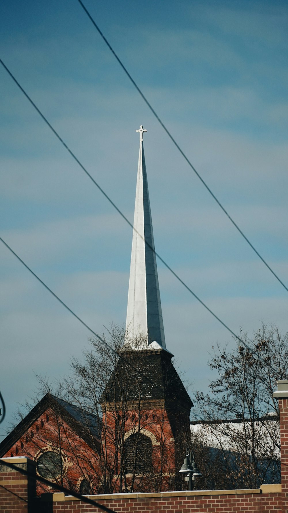 a church steeple with a cross on top