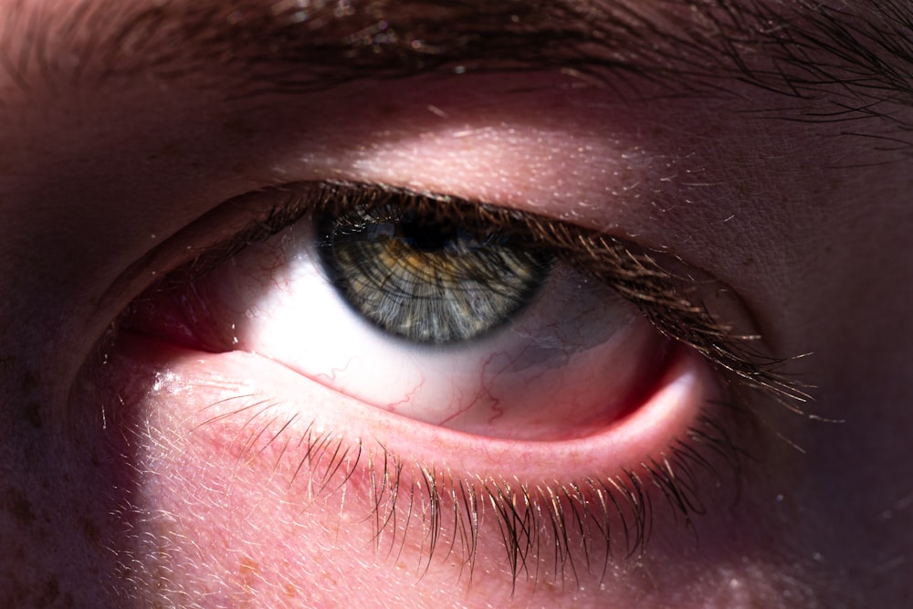 a close up of a person's blue eye