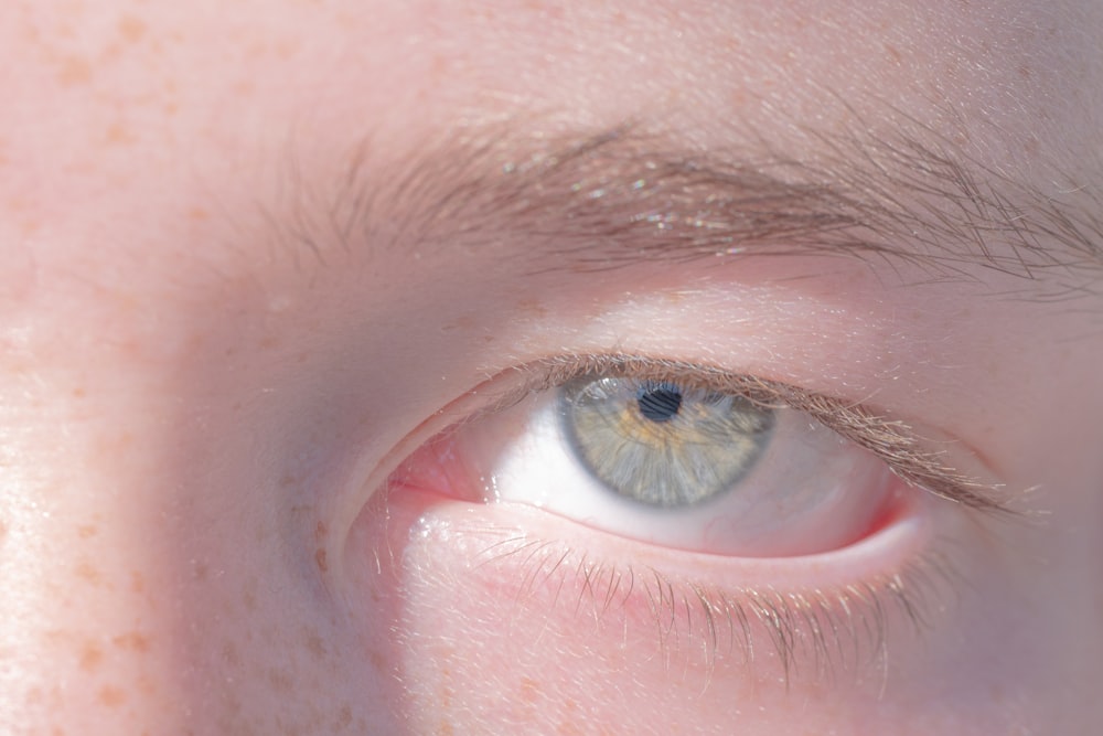 a close up of a person's blue eye