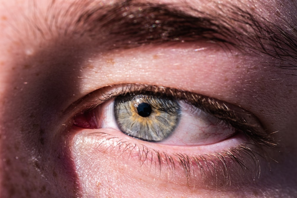 a close up of a person's blue eye