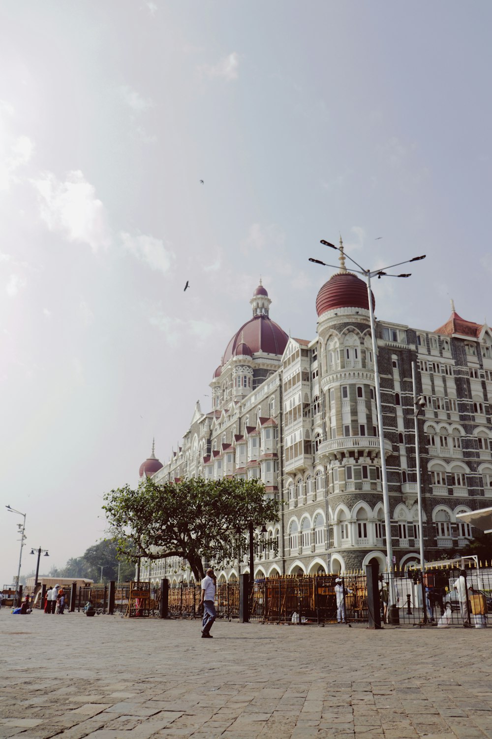 a large white building with a red dome on top of it