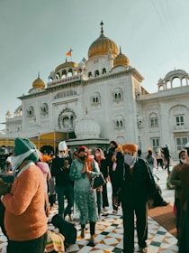 a group of people standing in front of a building