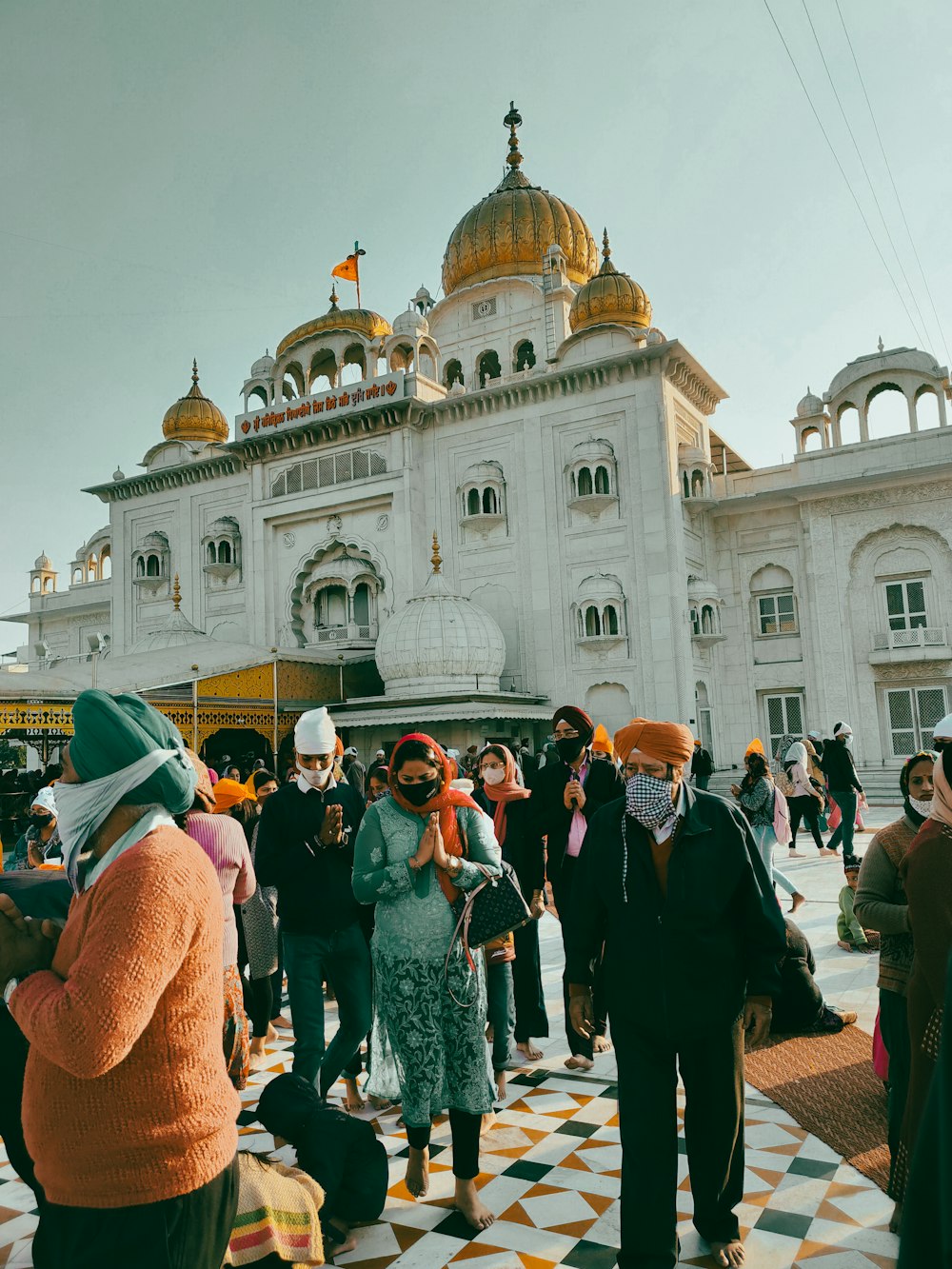 a group of people standing in front of a building