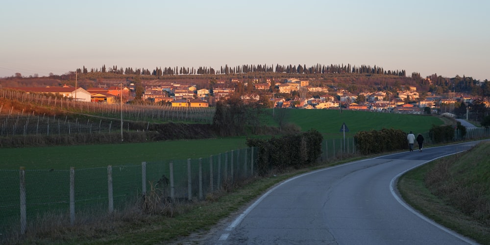 a road with a hill in the background