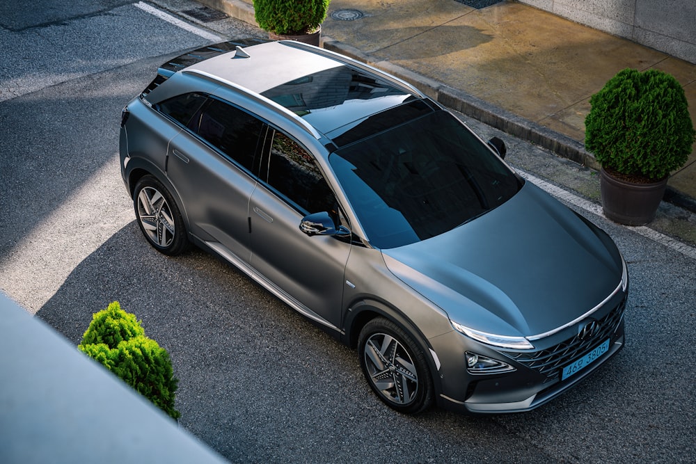 a silver car parked on the side of the road