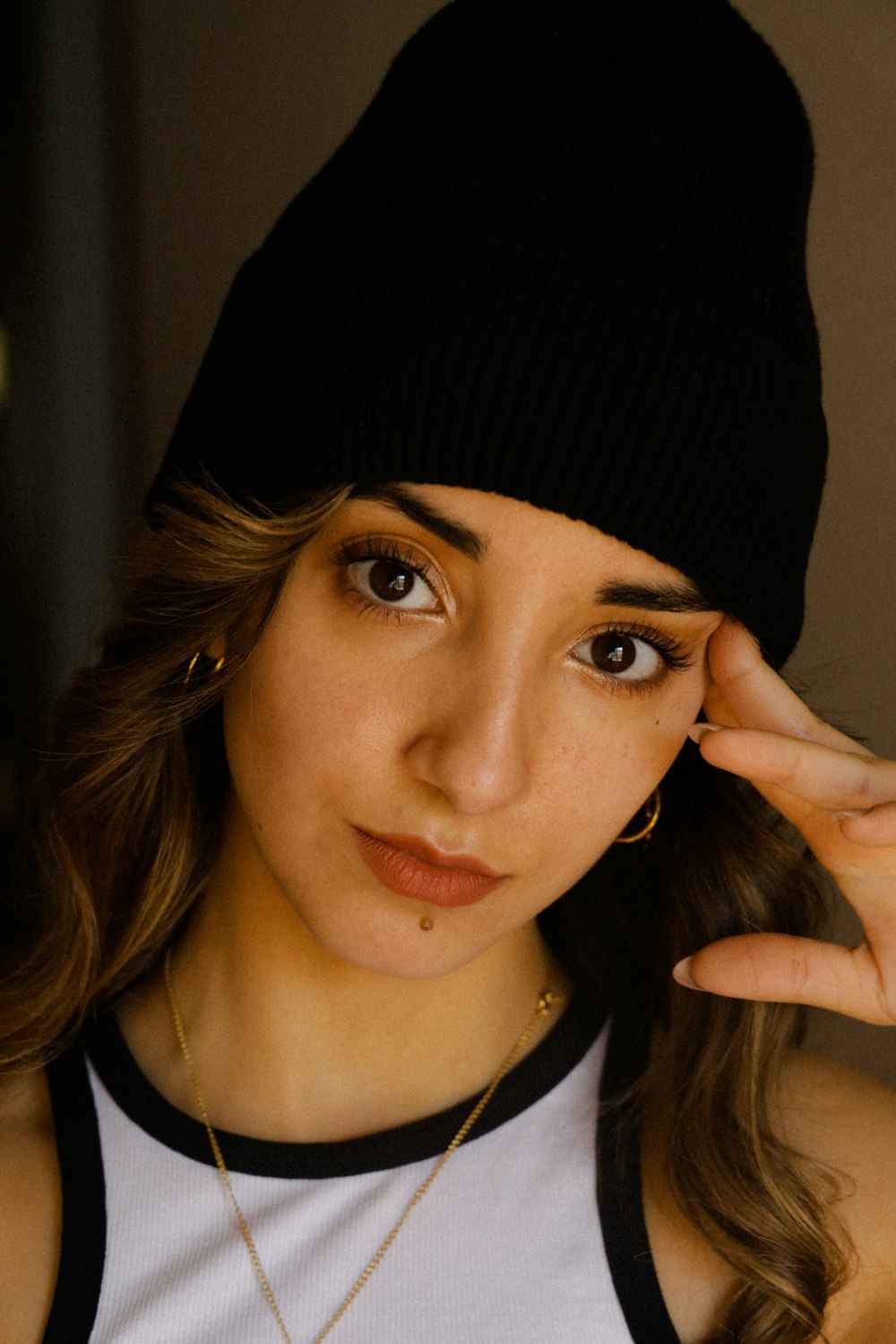 a close up of a woman wearing a hat