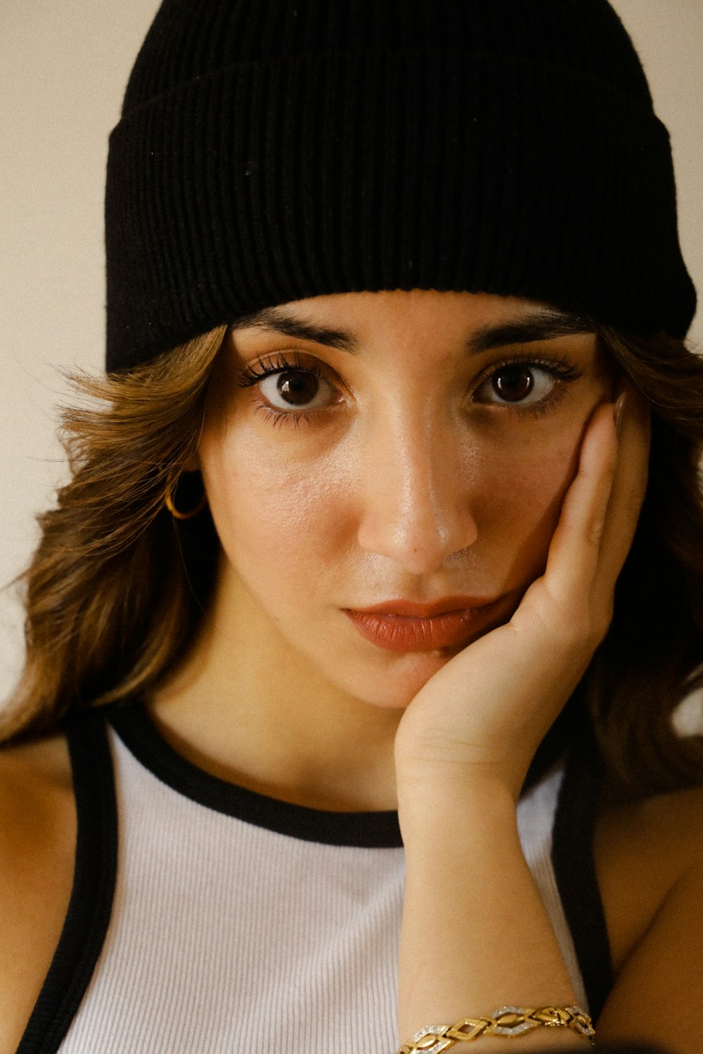 a close up of a woman wearing a hat