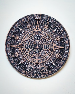 a black and gold plate with a design on it