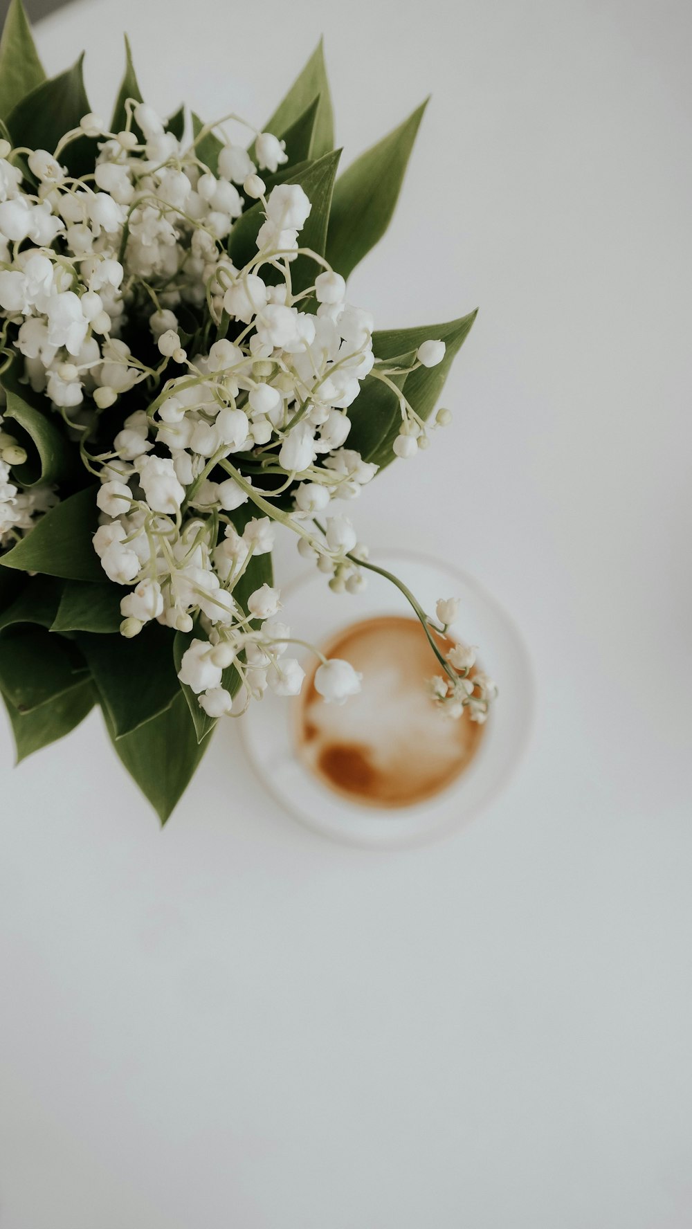 a bouquet of flowers sitting on top of a white table