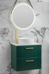 Close-up of a custom-designed vanity with elegant gold accents and polished surfaces.