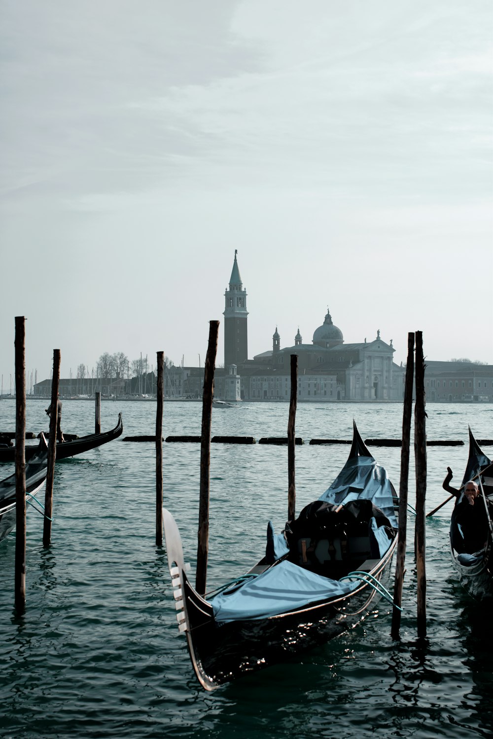 a couple of gondolas that are sitting in the water