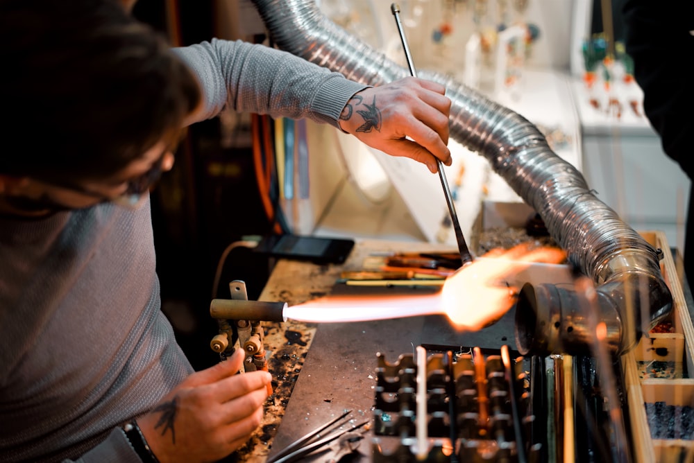 a man working on a piece of metal