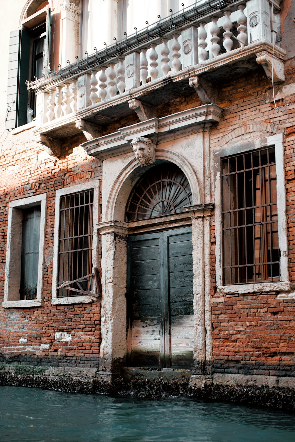 a building with a water canal in front of it