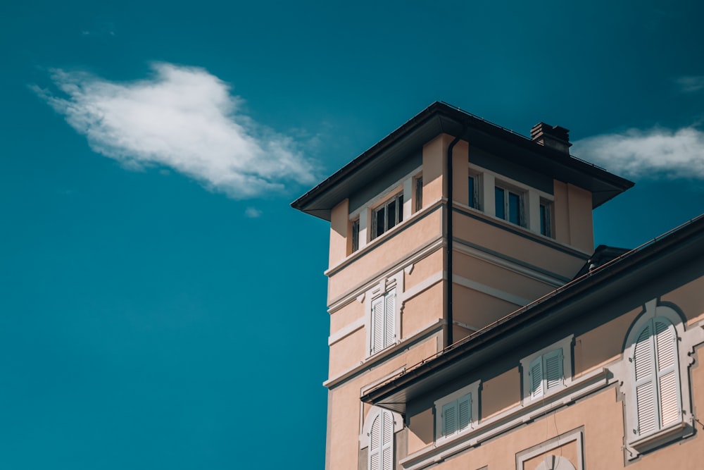 a tall building with a clock on the top of it